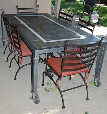 This Patio Table Is On Caster Wheels Which Makes Moving It Very Easy It Has A Slate Tile Top With A Marbl Outdoor Patio Table Outdoor Dining Table Patio Table