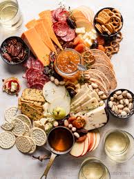 All you need to go is take a little shopping trip to your kitchen cabinets and cupboards, swing by the fridge for a short little pit stop, and you have all the makings of a delicious, simple cheese platter without leaving the house. Simple Cheese Board Easy Appetizer Idea