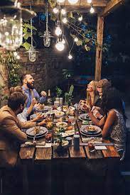 Dinner party games for adults are an entertaining essential along with home decor and chic really challenging trivia games can be a lot of fun, but for a dinner party, you may want to keep things a. Friends Having Fun At Dinner Party In The Yard By Lumina Dinner Party