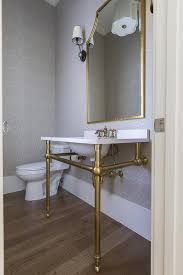 powder room sink vanity with brass legs