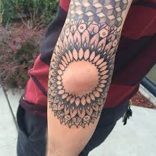 Elbow tattoo for men with a blue, black and green ink design make them look captivating men will go for an elbow tattoo with a black, blue and green ink design on a brown skin to make them look captivating and attractive 11. 120 Best Elbow Tattoo Designs Meanings Popular Types 2019