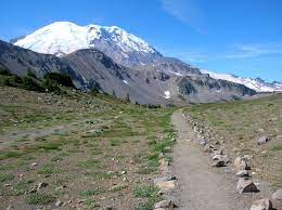 An active volcano topping out at 14,411 feet, mount rainier rises dramatically from the surrounding cascade range. Hiking Wonderland Trail Visit Rainier