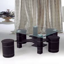 The table features this sculptural, black base with an unusual form that makes perfect sense when the four little ottomans take their place under the clear glass top. Coffee Table With Stools Underneath Ideas On Foter