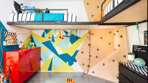 Indoor rock climbing plywood wall with a narrow hatch that leads to the living area. This Kids Room Went Through A Major Makeover And Now There S A Rock Wall