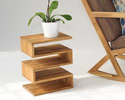 A rustic side table will have farmhouse charm with a distressed look and subdued design, adding a warm sense of comfort. Wood Coffee Sidetable Futon Company