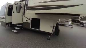 This coach has a master suite with king size bed, second bedroom/office for guests or work, and plenty of kitchen/living room space to have company or lounge with your family. 2015 Grand Design Solitude 379 Fl Five Slide Front Living Room Fifth Wheel Youtube