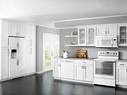 Though this kitchen's range and cabinets are both white, one has brass. How To Match Appliances And Kitchen Cabinets Colors Black And White Kitchen Appliances