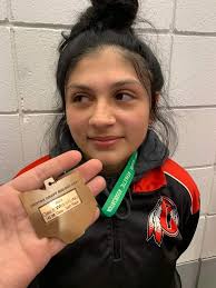 This is my daughter. She was the first ever girl to qualify for state. She  is also a Freshman this weekend she took 6th place in 145 weight class. At  The Ohio's