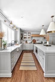 Accent colors include a deep brown range hood black kitchen island and deep grey marble countertops. Grey Kitchen Inspiration For 2021 Home Bunch Interior Design Ideas