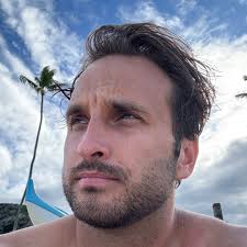 Michael Gracey, best known for the 2017 Hugh Jackman musical The Greatest  Showman, is in talks to direct Disney's live-action Tangled remake. Link in  the comments for more.