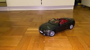 Playing with a BMW M4 cabrio toy car