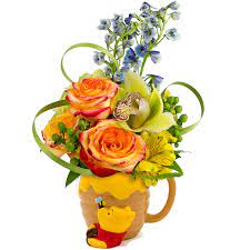 Visit the official winnie the pooh website to watch videos, play games, find activities, discover movies, browse photos, shop for merchandise and more! Winnie The Pooh The Honey Pot Bouquet Designed By Karin S Florist