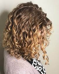 Lovely short hairstyles with natural cuts, the hair behind the nape of the neck is cut higher and lower toward the front to embrace the face. 30 Best Curly Hairstyles For Medium Hair Belletag