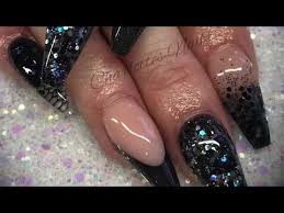 Black nail shades may not be somewhat feminine but can be quite attractive even applied in a decorative way. Acrylic Nails Black Sparkle Design