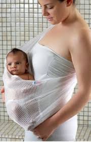 The Bathing Babies Shower Sling Capitalizes On The Feelings Of Comfort And Security That Skin To Skin Contact Baby Bath Bringing Baby Home New Baby Products