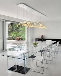 Dramatic Cascading Chandeliers Unleash Visual Splendor And Pomp Dining Room Contemporary Dining Table Lighting Minimalist Dining Room