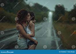 Girls Lesbians Kissing Under the Heavy Rain. Stock Image - Image of clench,  downpour: 57460463