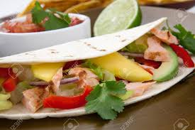 Preheat the broiler to low. Closeup Of Grilled Salmon Fish Tacos Served With Guacamole Fresh Tomatoes Salsa And Tortilla Chips Stock Photo Picture And Royalty Free Image Image 13135227