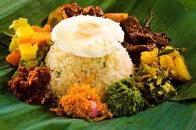 Lumprais Takeaway Oven Baked Rice Wrapped In A Banana Leaf And Served With Devilled Fish Of Your Choice Fried Egg With Roasted Food Baked Rice Rice Wraps
