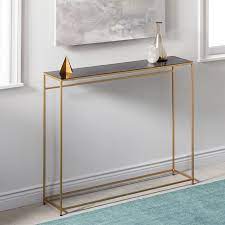 This chic console table stands 30 inches high, is 42 inches wide, and 14 inches deep. 10 Tiny Tables Perfect For The Smallest Of Entryways Home Decor Furniture Narrow Console Table