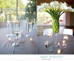 Check out this tall calla lily centerpiece and see more inspirational photos on theknot.com. Pin By Sarah Ainsworth On Sarah Ainsworth Weddings Wedding Centerpieces Calla Lily Centerpieces Tall Wedding Centerpieces