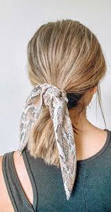 A scarf knotted on the side. 45 Pretty Ways To Style Your Hair With A Scarf Easy Hairstyle With Scarf How To Wear A Hair Scarf Ponytail Head Scarf Styles For Short Hair Cute Ways To Wear A