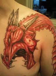 A woman with a red dragon tattoo on her arm at the national eisteddfod of wales, wrexham 2011. Welsh Dragon Stu Art