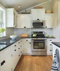 One great way to break up the use of white is with a dark colored countertop! Pin By Hailey Drucker On Wellington Options Freestanding Kitchen Black Kitchen Countertops Kitchen Remodel Small