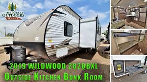 You surely need a travel trailer with a king bed. New 2019 Wildwood 282qbxl Quad Bunk Beds Outside Kitchen Travel Trailer Rv Colorado Sales Youtube
