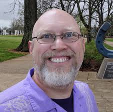 PERI faculty members (from left) Steven Sprick Schuster, Daniel Smith, and  Ennio Piano celebrate PERI Fellow Protik Nandy's suc