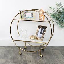 I love metal frames on these barware furniture pieces, but rose gold is also a great color to consider. Gold Marble Round Bar Cart Drinks Trolley
