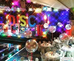 Guests were asked to come in 70's dress, music from the 70's was playing and the room was decorated with an array of 70's nick knacks!! Christmas Party With A 70 S Disco Theme The Very Best Balloon Blog 70s Party Theme 70s Theme Party Disco Party Decorations