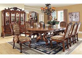 Find the perfect home furnishings at hayneedle, where you can buy online while you explore our room designs and curated looks for tips, ideas & inspiration to help you along the way. Medieve Cherry Oval Dining Table W 2 Arm Chair And 4 Side Chair Signature Home Furniture