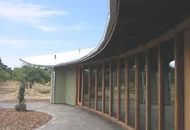 The front & rear walls are parallel curves, with an inner curved wall filled with glass & an outer the straw bale outer walls provide great insulation from both the weather and sound, and the deeply recessed windows create natural spaces for plants and/or art. Straw Bale House Plans Architecturalhouseplans Com