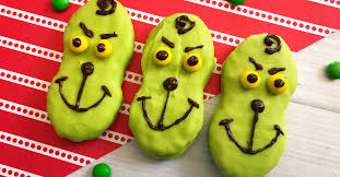 You know the classic peanut butter sandwich cookie we all know and love, we even shared a homemade version here that you've got to make at home, but today we want to share these 25+ creative nutter butter cookies. How The Grinch Stole Christmas Nutter Butters Decorated Cookies