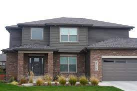 We have used it as a house color, as well as trim, doors, and shutters. Dark Siding Combinations Carlson Exteriors Inc Brick Exterior House Brick House Exterior Colors Red Brick House Exterior