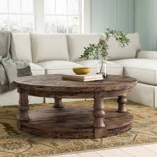 The round air coffee table is distinguished for its elegant, essential lines. Anner Floor Shelf Coffee Table With Storage Reviews Birch Lane