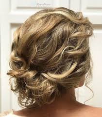While this might be on the curlier side of wavy hair, it's definitely one of the loveliest long hairstyles for wavy hair! Untamed Tresses Naturally Curly Wedding Hairstyles