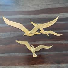 Beach wall art flock of seagulls wall sculpture modern decor, gray decor set of 4, largest seagull is 21 across biminishoresdecor 4.5 out of 5 stars (55) $ 85.00 free. Vintage Wall Decor Mid Century Brass Large Seagull Wall Art Set Poshmark