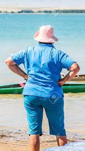 Mature Woman With Booty In Pants And In Panama Stock Photo, Picture and  Royalty Free Image. Image 107993280.