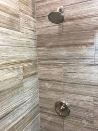 The ease of cleaning, the durability, the versatility and most of all the stylish. Bathroom Shower With Beautiful Decorative Stone Tiles Shower Stock Photo Picture And Royalty Free Image Image 125499332