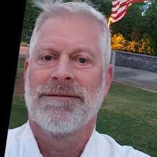 Vice President Rickey Bailey (L) presented Planner Shane Meigs (R) with a… 