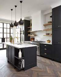 Black is the last color to capture a kitchen, black cabinets, black countertops and black floors, but today, you will be amazed with the 15 astounishing black kitchen cabinets that we have prepared. Black Kitchen Cabinets Make A Bold Statement 23 Effective Ways Kitchen Cabinet Design Kitchen Design Beautiful Kitchen Cabinets