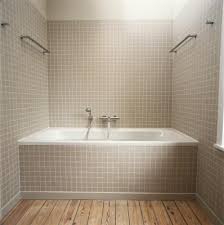 The tile is applied to plaster over terra block (called johnson block) & it will be a pain to remove. How To Tile A Plastic Tub