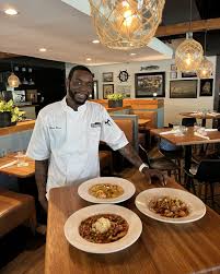 🧑‍🍳 Chef spotlight: Executive Chef Akeem Brown 🌟 Favorite menu items:  Hot Honey Fried Chicken and She Crab Soup. 🌟 He learned to cook by  watching his grandma and aunt prepare family