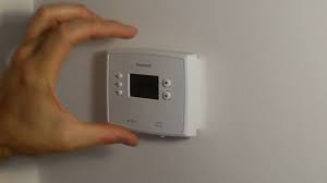 Most thermostats can be removed from their base by gently pulling them away from the wall. How To Change Batteries On Honeywell Thermostat Rth2300 Rth221 Youtube
