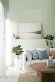 Sage wall in bedroom.bed and bedding according to vastu. What To Know About Decorating With Sage Green