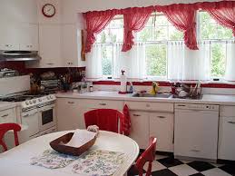 The dutch colonial revival style is distinguished by its gambrel roof, with or without flared eaves, and the frequent use of dormers. David Creates A Sunny Red And White Vintage Kitchen For His 1930 Dutch Colonial House