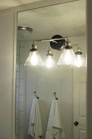 Bathroom Light Fixture On Mirror Image Of Bathroom And Closet