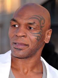 Mike Tyson Tattoo With Maori Symbol Around Left Eye Tattoo Ink Celebrity Maori Tattoo Celebrity Tattoos Mike Tyson Tattoo